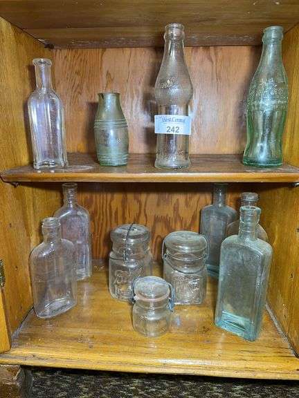 Collection of Clear Glass Bottles and Jars image