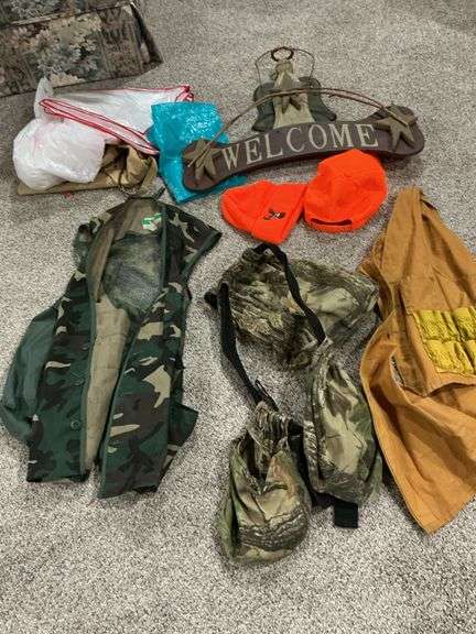 Hunting Gear Lot: Welcome Sign, Camouflage Vests, Orange Stocking Caps, Bags image