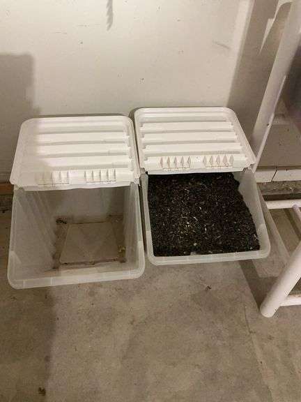 Pair of Large Storage Containers, One Filled with Bird Seed image