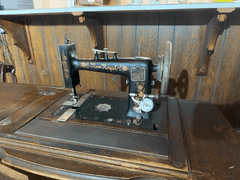 New Royal Treadle Sewing Machine in Cabinet