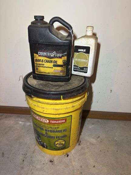 Assorted Oils and Fluids: Bar & Chain Oil, Engine Oil, and Tractor Hydraulic Fluid image