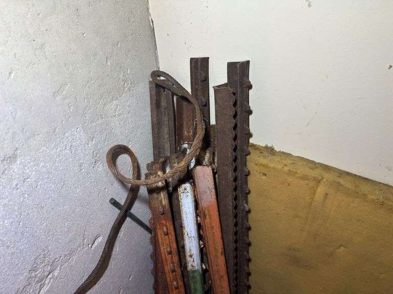Bundle of Metal Fence Posts and Other Metal Pieces