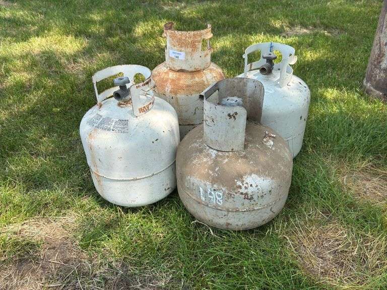 Four Assorted Propane Tanks image