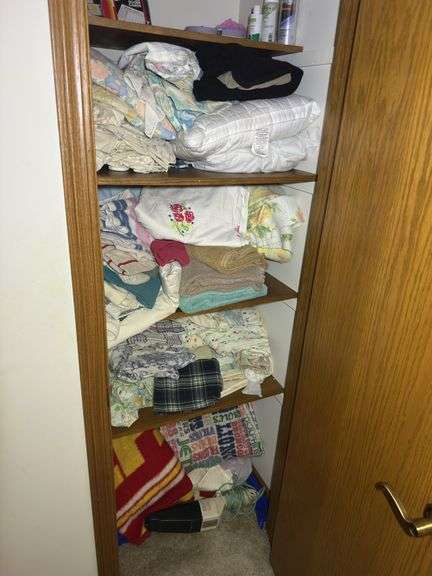Contents of Closet: Linens, Pillows, Games, & More image