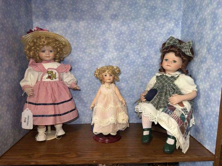 Three Collectible Porcelain Dolls image