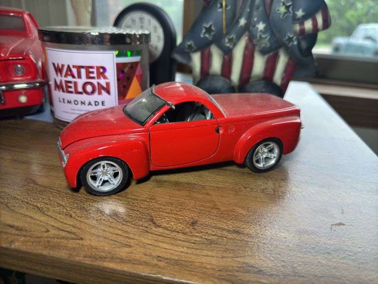 Mixed Collection: Uncle Sam Figure, Ford Mustang, Clock, Candle, and Figurine