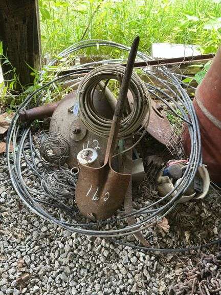 Farm Salvage Lot with Electrical Wire and Shovel image