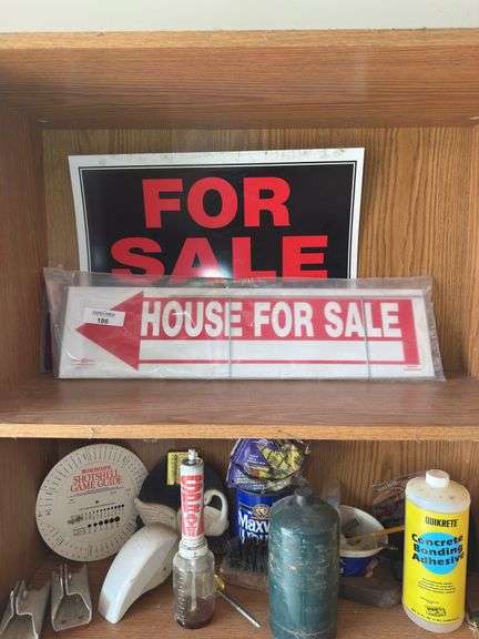 Contents of shelf with 'House for Sale' Sign, Tools, and Supplies
