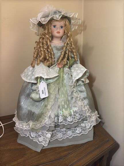 Collectible Porcelain Doll with Dress and Hat image