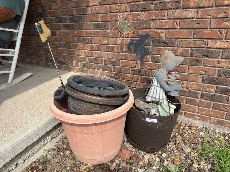 Garden Decor Lot: Flower Pots, Sun Face, and Metal Girl Statue image