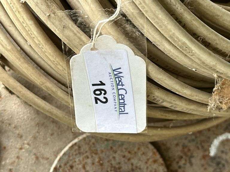 Farm Salvage Lot with Electrical Wire and Shovel