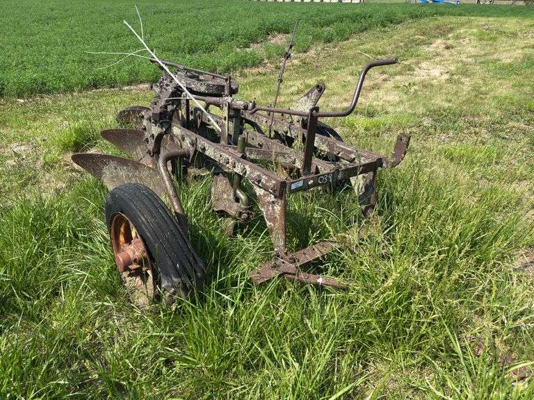 John Deere 3 bottom pull type plow, spoke wheels image