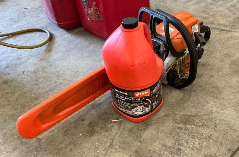 Stihl Chainsaw with Bar Cover and Chain Oil image