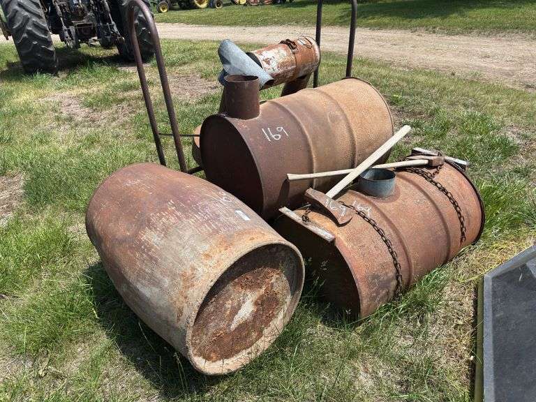Metal Barrel wood stove, Republic Heater, axes, and Firewood Rack image
