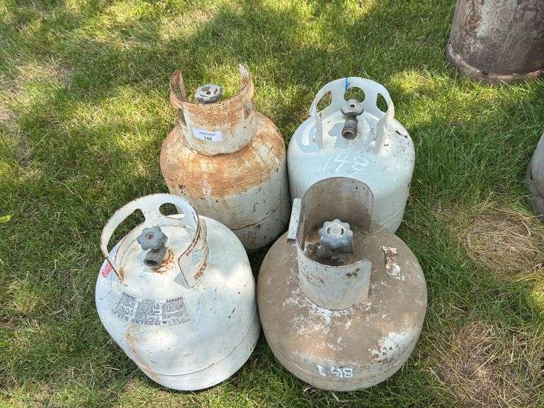 Four Assorted Propane Tanks