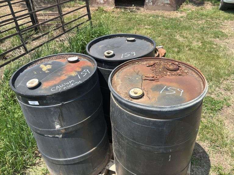Three 55-Gallon Plastic Drums with Calcium Chloride. image