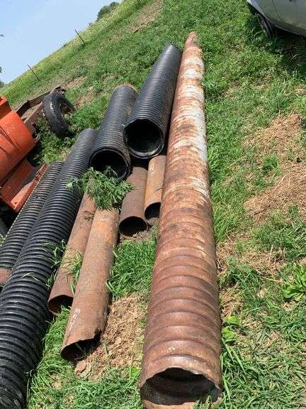 Assorted Metal and Plastic Drainage Pipes