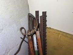 Bundle of Metal Fence Posts and Other Metal Pieces