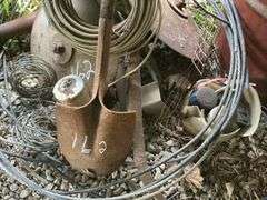 Farm Salvage Lot with Electrical Wire and Shovel