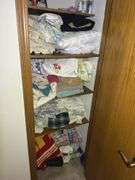 Contents of Closet: Linens, Pillows, Games, & More