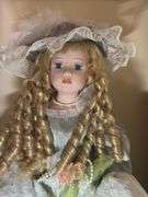 Collectible Porcelain Doll with Dress and Hat