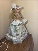Collectible Porcelain Doll with Dress and Hat