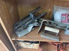 Contents of shelf with 'House for Sale' Sign, Tools, and Supplies