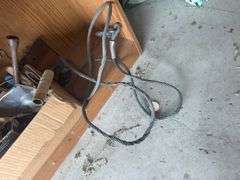 Contents of shelf with 'House for Sale' Sign, Tools, and Supplies
