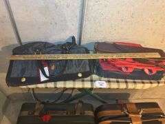 Adolfo Duxbury & Samsonite Luggage with Curtain Rods, and ironing board