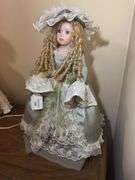 Collectible Porcelain Doll with Dress and Hat
