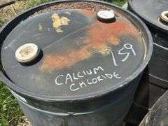 Three 55-Gallon Plastic Drums with Calcium Chloride.