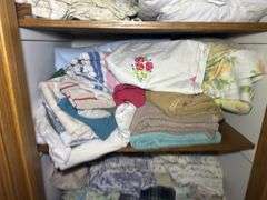 Contents of Closet: Linens, Pillows, Games, & More