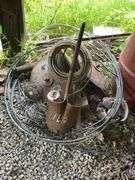 Farm Salvage Lot with Electrical Wire and Shovel