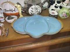 Shelf of Various Decorative Items and Fire King Dish