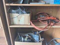Contents of shelf with 'House for Sale' Sign, Tools, and Supplies