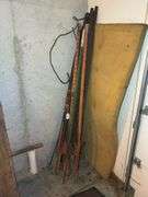 Bundle of Metal Fence Posts and Other Metal Pieces