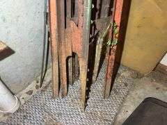 Bundle of Metal Fence Posts and Other Metal Pieces