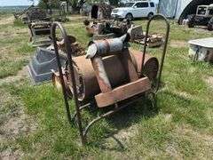 Metal Barrel wood stove, Republic Heater, axes, and Firewood Rack