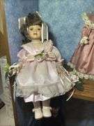 Collection of Three Porcelain Dolls with Accessories