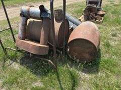 Metal Barrel wood stove, Republic Heater, axes, and Firewood Rack