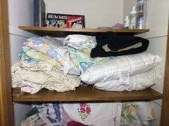 Contents of Closet: Linens, Pillows, Games, & More