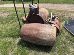 Metal Barrel wood stove, Republic Heater, axes, and Firewood Rack