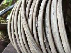 Farm Salvage Lot with Electrical Wire and Shovel