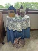 Variety of Home Decor Items: Table Clock, Coasters, Deer Statue, and More