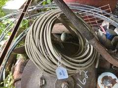 Farm Salvage Lot with Electrical Wire and Shovel