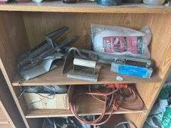 Contents of shelf with 'House for Sale' Sign, Tools, and Supplies