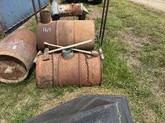 Metal Barrel wood stove, Republic Heater, axes, and Firewood Rack