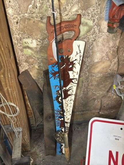 Decorative Hand Saw and Fishing Rod image