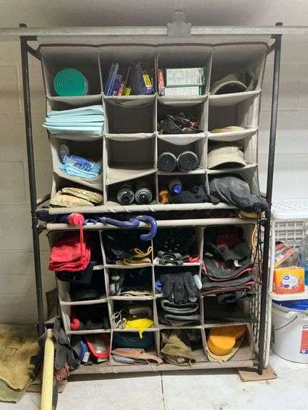 Organized Utility Rack with Various Supplies image