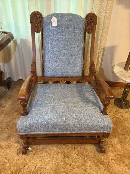 Ornate Carved Wood Rocking Chair with Blue Upholstery image